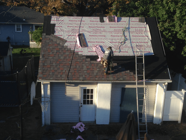 During- Nice view of our diligent workers putting in new shingles